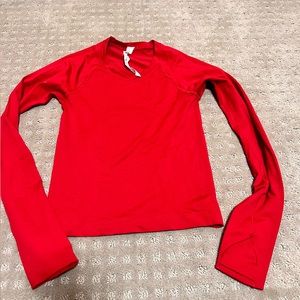 Women’s like red swiftly tech in size 2.